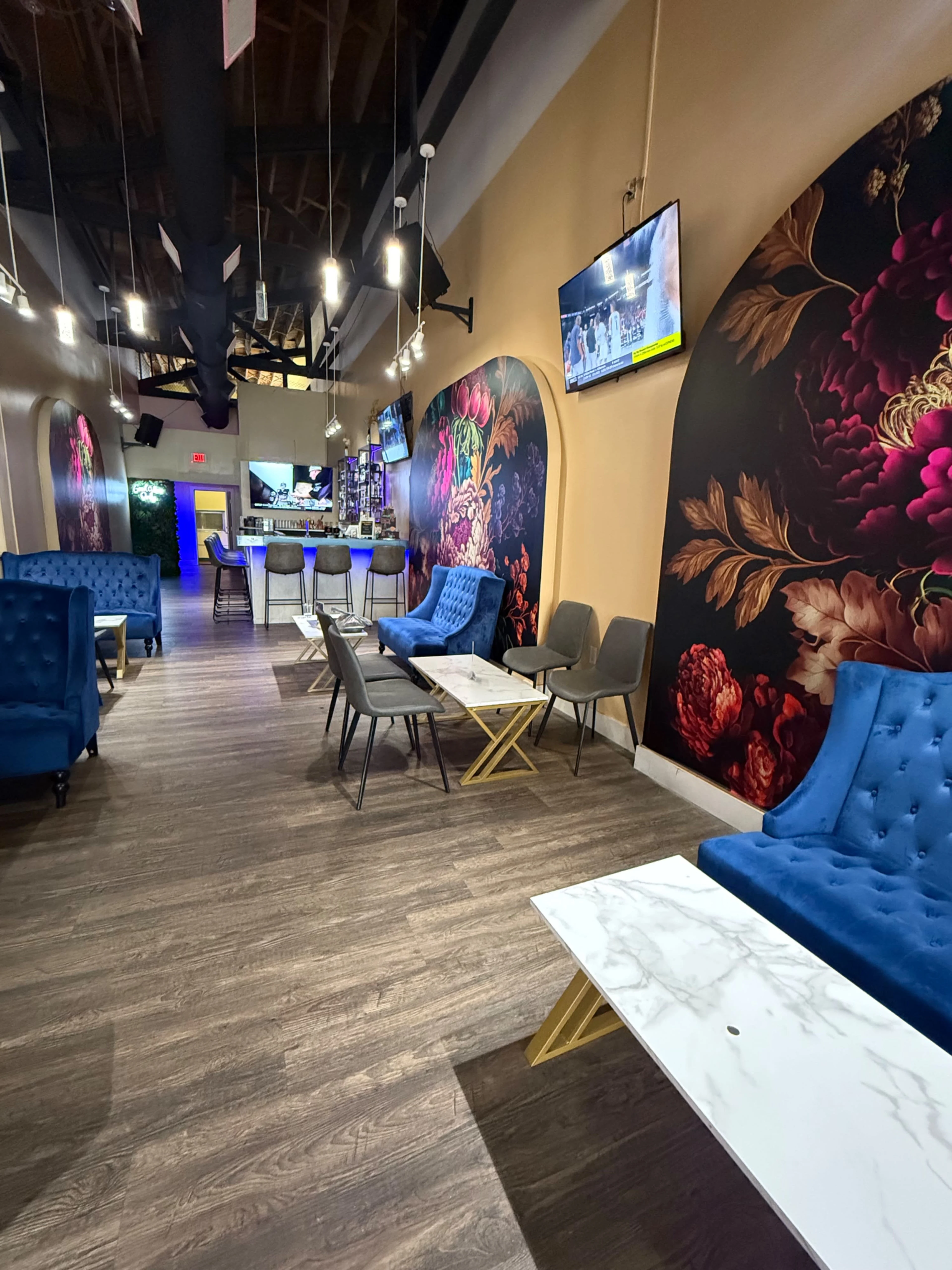 Club lounge illuminated with deep neon magenta lighting