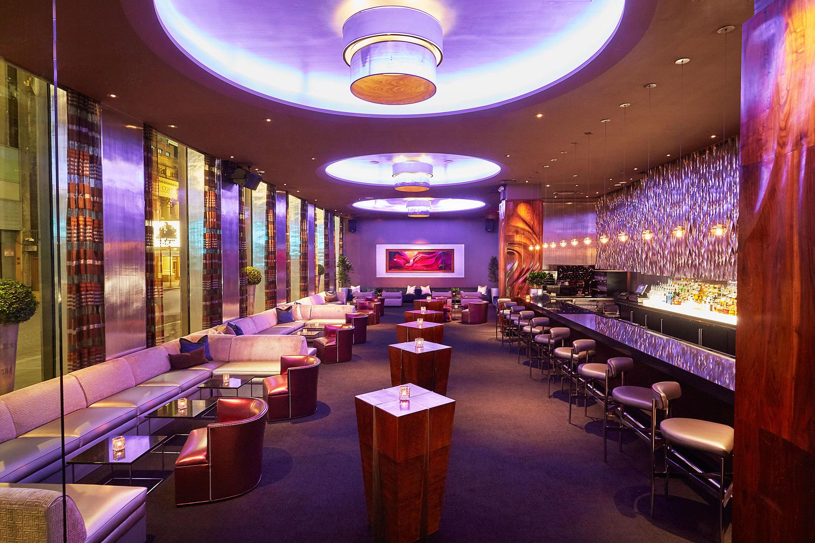 Nightclub dance floor with VIP bottle service booths