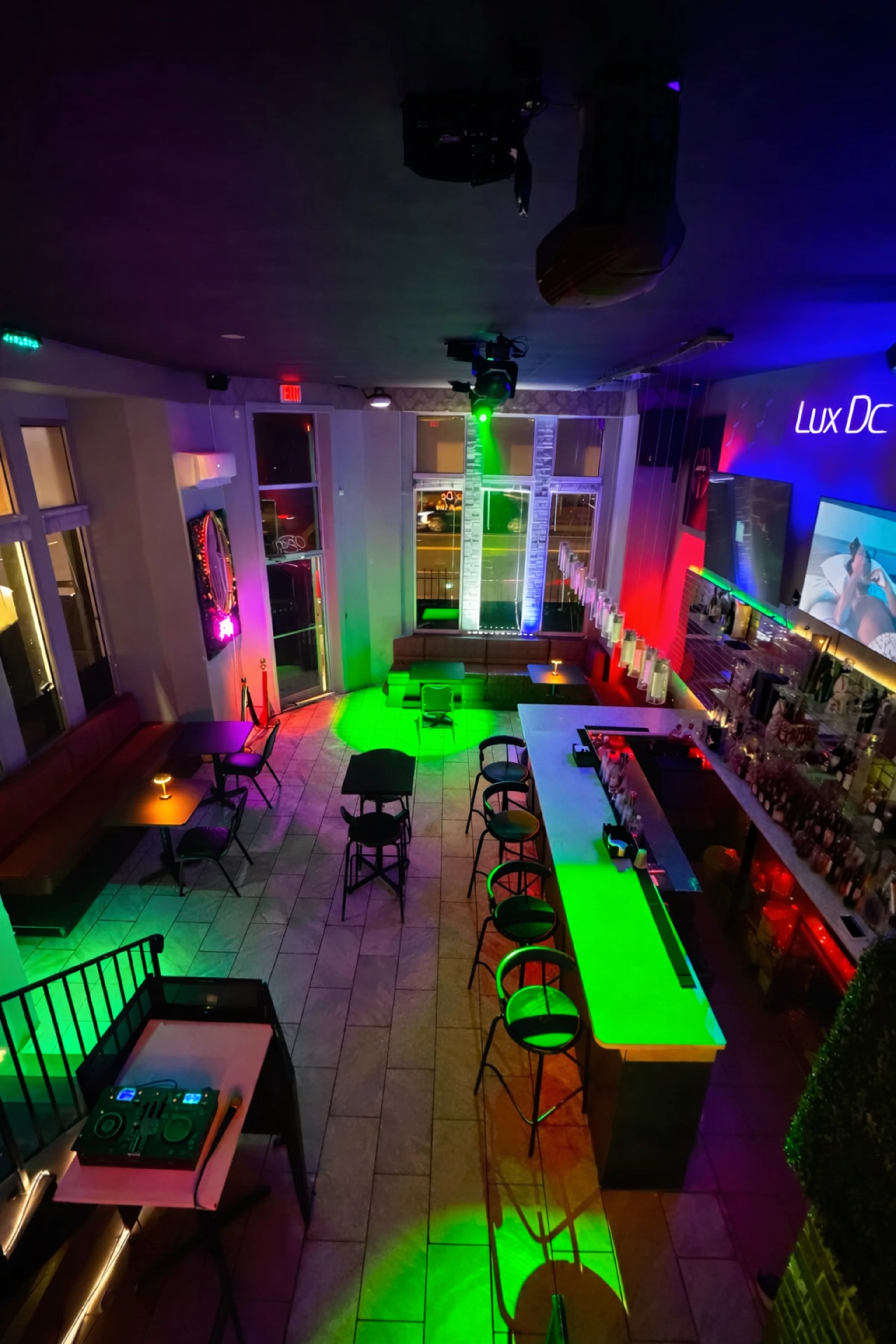 Backlit liquor display and high-ceiling luxury lounge