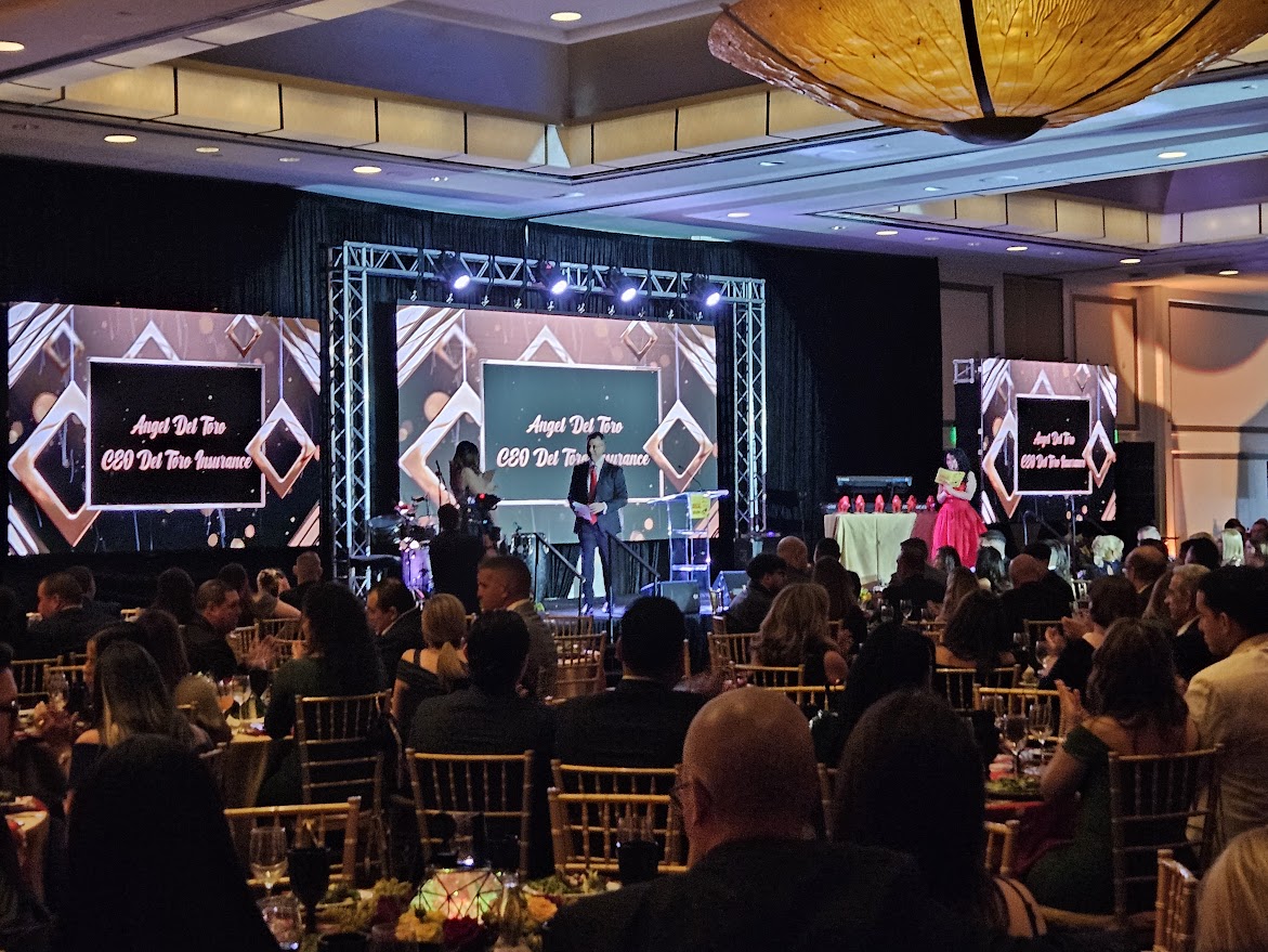 Polished DJ setup with column sound and lighting for private corporate gala