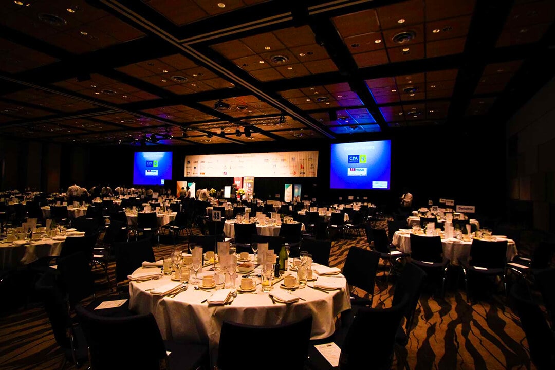 Stage lighting and banquet setup for private celebration