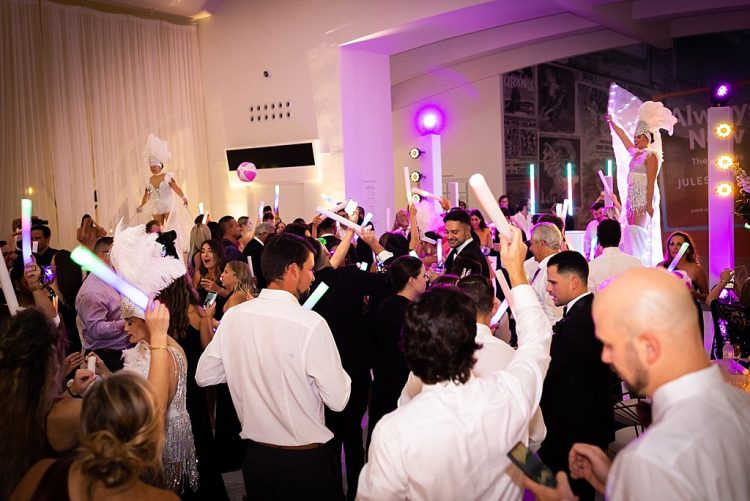 Ballroom DJ booth with warm ambient uplighting