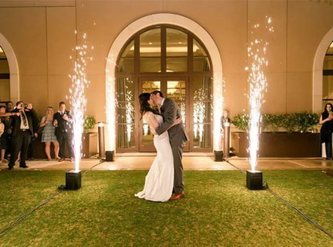 Indoor cold spark fountain machines framing wedding exit
